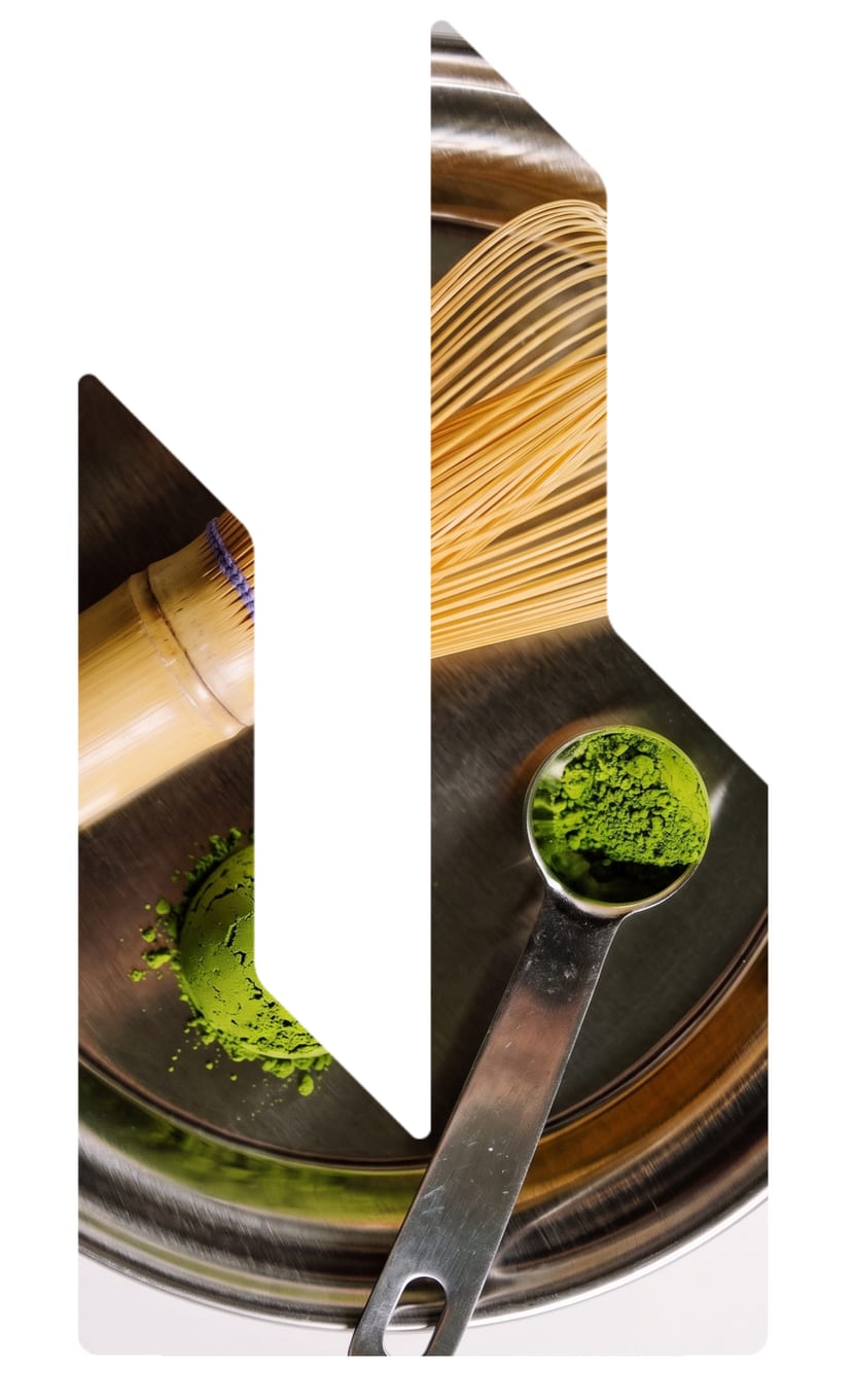 Matcha powder, scoop, and bamboo whisk
